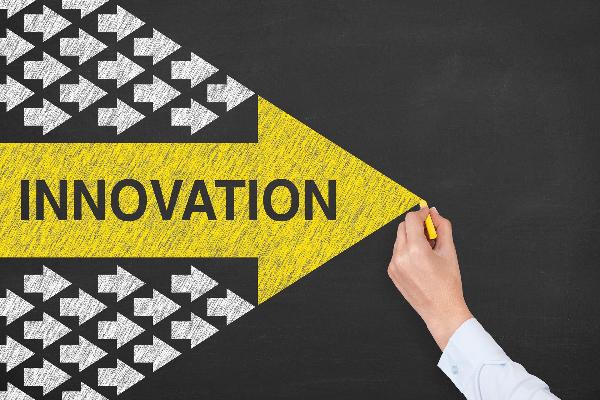 Innovation Concepts with Arrows on Chalkboard Background